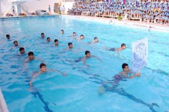School-Team-doing-a-drill-to-inaugurate-the-Swimming-Competition