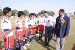 The-Cheif-Guest-shaking-hands-with-the-young-footballers-of-our-school-at-IPSC-Football-Meet